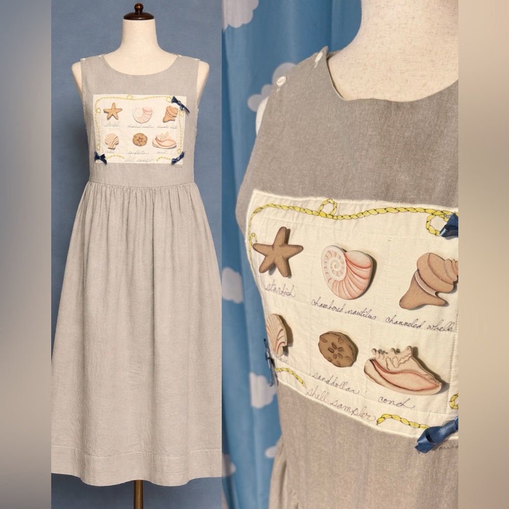 Vintage shell 90s teacher dress.  Beige button sides and straps. M